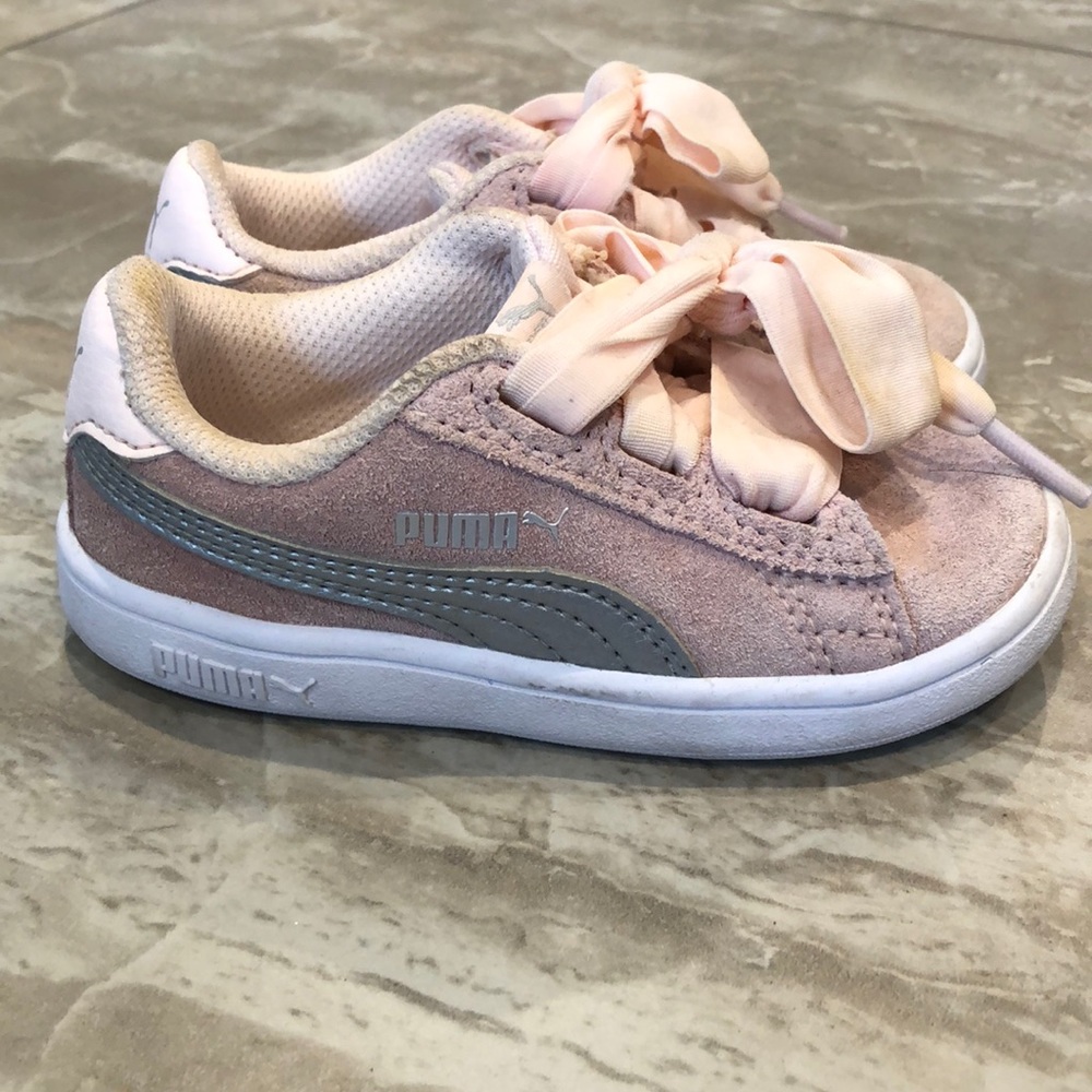 Pink suede Puma shoes with wide ribbon laces